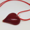 Pendentif en forme de coeur rouge transparent