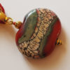 Perle plate rouge en verre de murano