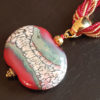 Perle plate rouge en verre de murano